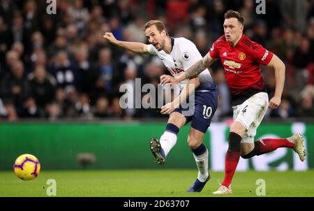 Tottenham Hotspur's Harry Kane (left) attempts a shot on goal Stock Photo