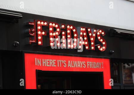 A view of a sign for a TGI Fridays restaurant in London. Stock Photo