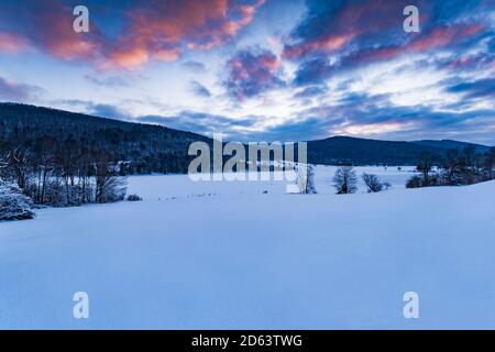 Dawn breaks on a snowy Quaker Lake Allegany State Park, Cattaraugus County, New York Stock Photo
