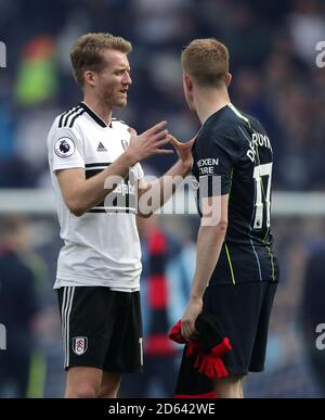Fulham's Andre Schurrle (left) and Manchester City's Kevin De Bruyne talk after the game Stock Photo
