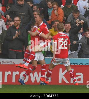 Barnsley's Cauley Woodrow (centre) celebrates scoring his side's second goal of the game with team-mates Stock Photo