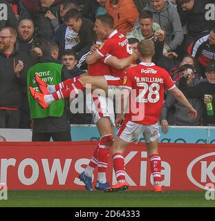 Barnsley's Cauley Woodrow (centre) celebrates scoring his side's second goal of the game with team-mates Stock Photo