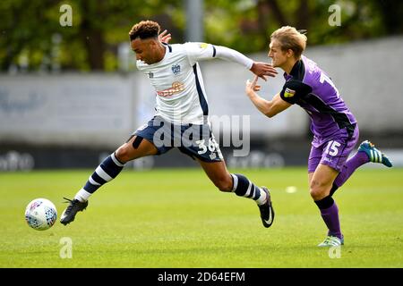 Bury’'s Nicky Maynard and Port Vale's Nathan Smith battle for the ball  Stock Photo