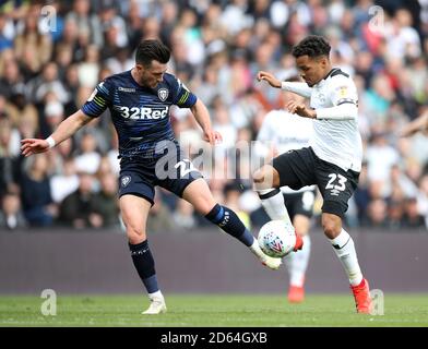 Derby County's Duane Holmes (right) and Leeds United's Jack Harrison battle for the ball Stock Photo