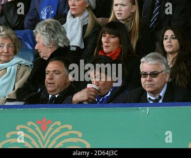 Actor Sylvester Stallone has a drink during the game, as Everton Chairman Bill Kenwright (r) looks on with Rober Earl (l) Stock Photo
