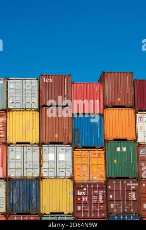 Containers stacked on a ship ready to be transported Stock Photo - Alamy