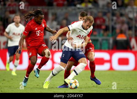 Tottenham Hotspur's Harry Kane (centre) and Bayern Munich's Renato Sanches (left) and Ivan Mihaljevic (right) Stock Photo