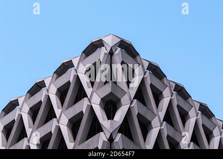 Detail of brutalist concrete diamond shaped facade of the car park in Welbeck Street , London. Stock Photo