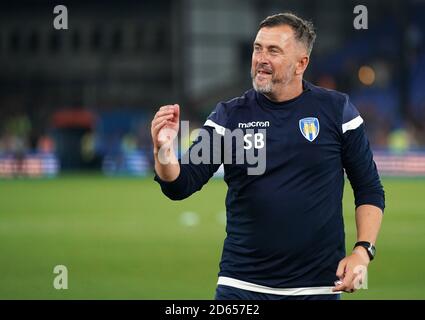 Colchester United assistant manager Steve Ball celebrates winning the tie Stock Photo