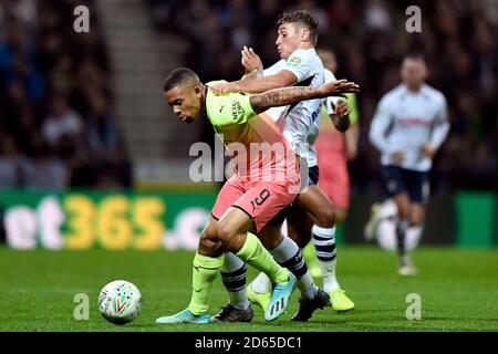 Manchester City's Gabriel Jesus and  Preston North End's Ryan Ledson battle for the ball Stock Photo