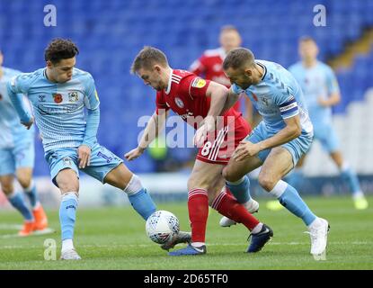 Coventry City's Callum O'Hare and Liam Kelly battles for the ball with Accrington Stanley's Sam Finley Stock Photo