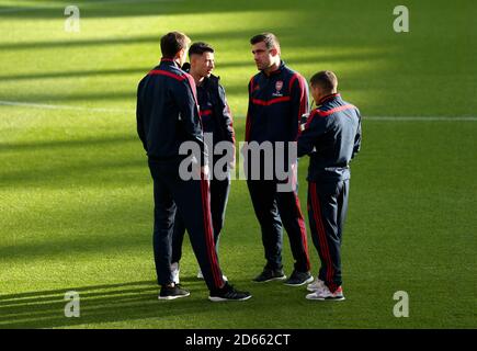 Arsenal players inspect the pitch prior to the beginning of the match Stock Photo