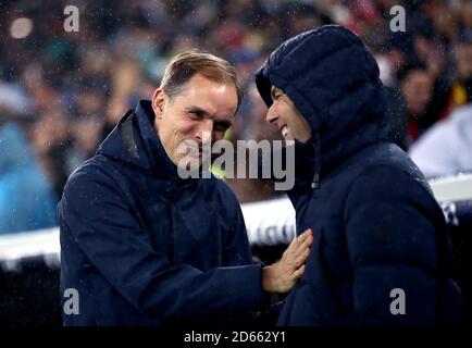 Paris Saint-Germain manager Thomas Tuchel (left) greets Real Madrid manager Zinedine Zidane Stock Photo