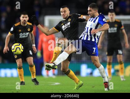 Wolverhampton Wanderers' Romain Saiss (left) and Brighton and Hove Albion's Neal Maupay Stock Photo