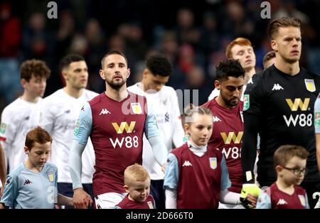 Aston Villa's Conor Hourihane (left) walks out on to the pitch prior to the beginning of the match Stock Photo