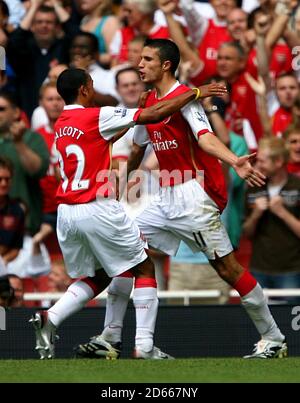 Arsenal's Robin Van Persie celebrates after equalising from the penalty spot Stock Photo