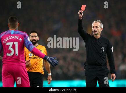 Referee Martin Atkinson shows Manchester City goalkeeper Ederson a red card Stock Photo
