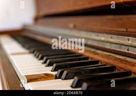 An old upright piano is displayed in Cades Cove Methodist Church at Great Smoky Mountains National Park, Nov. 2, 2017, in Townsend, Tennessee. Stock Photo