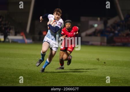 Manchester, England, 7 February 2020. Elliot Obatoyinbo of Saracens chasing Simon Hammersley of Sale Sharks who is running with the ball during their Gallagher Premiership Cup semi final match at the A J Bell Stadium. Stock Photo