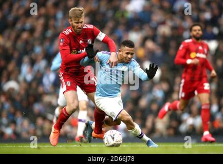 Fulham's Tim Ream (left) brings down Manchester City's Gabriel Jesus, which results in a penalty and red card Stock Photo