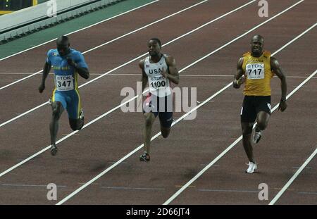 USA's Tyson Gay (middle) comes home to win the Men's 100m from Baharmas' Derrick Atkins (l) and Jamaica's Asafa Powell (r) Stock Photo