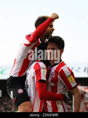 Brentford's Emiliano Marcondes Camargo Hansen (left) and Brentford's Christian Norgaard (right) celebrate after Brentford's Ollie Watkins (not pictured) scored his sideâ€™s third goal Stock Photo