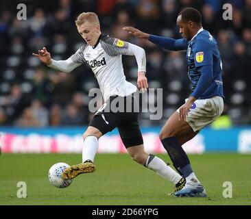 Derby County's Louie Sibley and Blackburn Rovers' Ryan Nyambe (right) battle for the ball Stock Photo