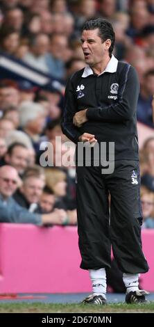 Queens Park Rangers' manager John Gregory makes a playful gesture to the West Bromwich Albion fans after they baited him during the game Stock Photo