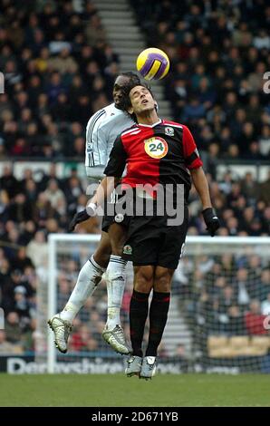 Derby County's Michael Johnson and Blackburn Rovers' Roque Santa Cruz battle for the ball in the air Stock Photo