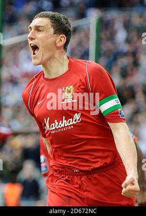 Milton Keynes Dons' Keith Andrews celebrates scoring the opening goal of the game from the penalty spot Stock Photo