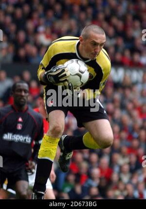 Charlton Athletic's goalkeeper Dean Kiely collects the ball against Manchester United Stock Photo