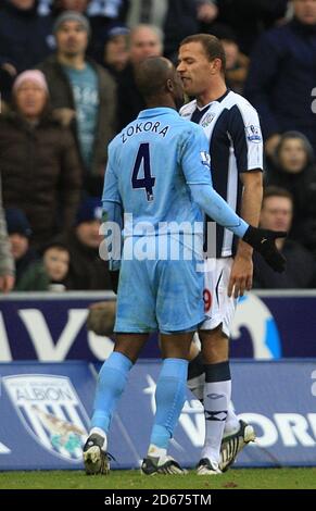 Tottenham Hotspur's Didier Zokora and West Bromwich Albion's Roman Bednar square up to one another during the game Stock Photo