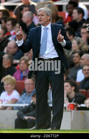 Manchester City manager Mark Hughes gives instructions from the touchline. Stock Photo