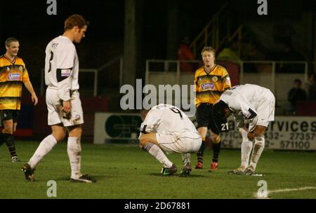 Dejected Hereford United's Simon Travis, Lee Mills and Tamika Mkandwire as Boston United reach the FA Cup 3rd round following their 3-2 victory Stock Photo