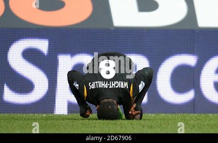 Manchester City's Shaun Wright-Phillips looks in pain after taking a knock early in the game Stock Photo