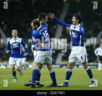 Birmingham City's Scott Dann celebrates scoring his sides first goal of the game with teammates Liam Ridgewell (right) and James McFadden (16) Stock Photo