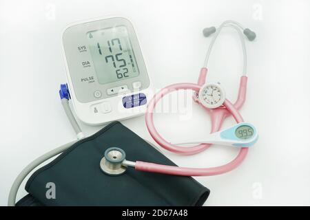 Blood pressure meter, stethoscope and thermometer on white background Stock Photo