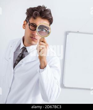 The funny doctor scientist making presentation in hospital Stock Photo