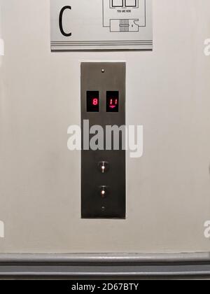 Elevator buttons up and down. The modern button panel on a wall. Stock Photo