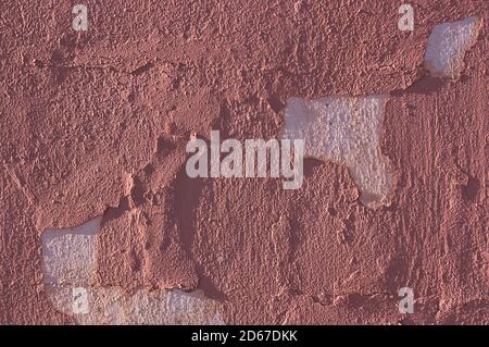 Exterior of an old house whose wall has peeling paint. Abstract background Stock Photo