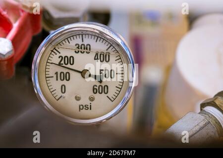 A closeup of a liquid filled analogue pressure guage Stock Photo