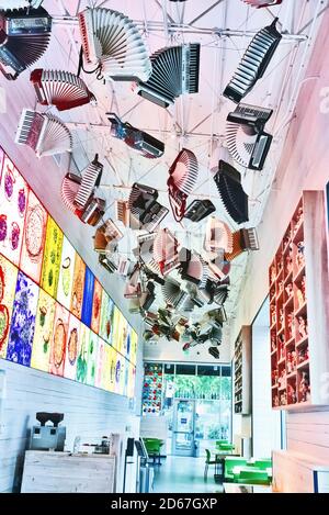 Cafe large collection of accordions hangs overhead , Chihuly Garden and Glass  museum , Seattle , USA Stock Photo