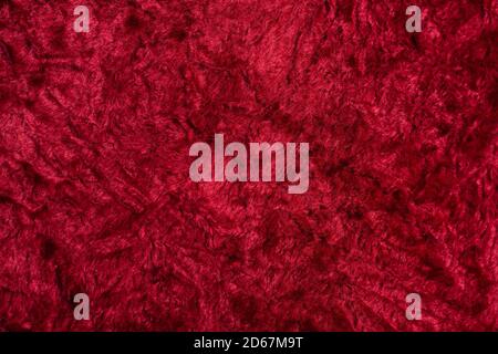 Closeup of red cherry carpet surface, texture for wallpaper or background Stock Photo