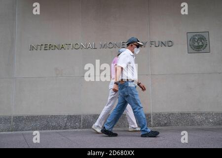Washington, USA. 17th July, 2020. People walk past the headquarters of the International Monetary Fund (IMF) in Washington, DC, the United States, July 17, 2020. Credit: Liu Jie/Xinhua/Alamy Live News Stock Photo