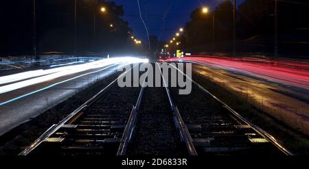 15 October 2020, Saxony, Leipzig: Cars roll across Jahnallee in the beginning rush hour next to the orphaned tracks of the tram. The trade union Verdi is calling on the 5000 Saxon public transport workers to go on warning strikes today. With the beginning of the early shift, buses and trains will no longer run. In addition to the nationwide demands, the focus in Saxony is, among other things, on a reduction of weekly working hours, a noticeable salary increase and special payments for long-term employees (recording with long-term exposure). Photo: Hendrik Schmidt/dpa-Zentralbild/dpa Stock Photo