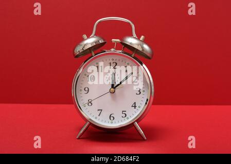 Alarm Clock Isolated on a red background Stock Photo
