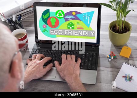 Eco friendly concept shown on a laptop used by a man Stock Photo