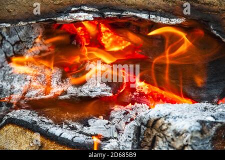 Campfire, burning wood at a tourist campsite in England Stock Photo