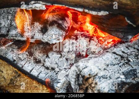 Campfire, burning wood at a tourist campsite in England Stock Photo