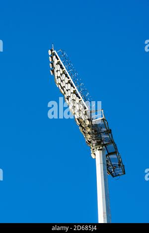 stadium floodlights or lighting against a blue sky Stock Photo